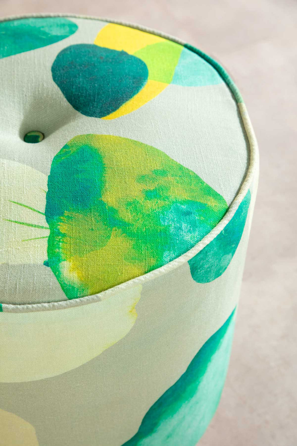 Upholstered Bundle Flower Pouffe in Chasing Monsoon Fabric