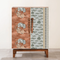 Pod Upholstered Cabinet in Dance of the Yalis Fabric
