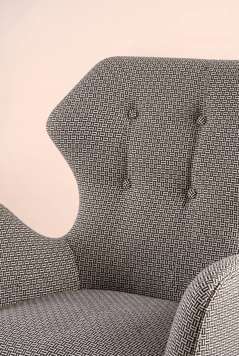 Upholstered Bundle Winged Accent Chair in Nilgiri Black and White Fabric