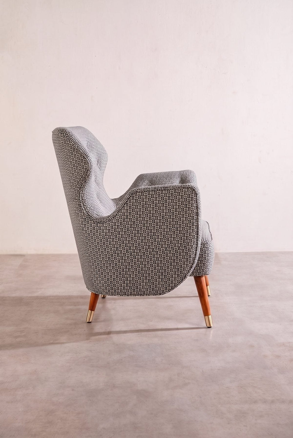 Upholstered Bundle Winged Accent Chair in Nilgiri Black and White Fabric